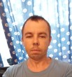 николай
