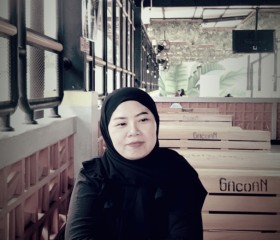 Mela, 40, Jakarta