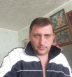 николай