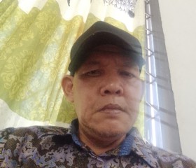 Husnan, 48, Binjai