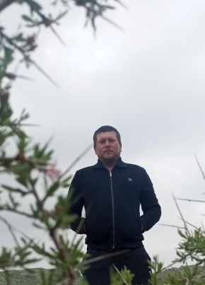 Комил