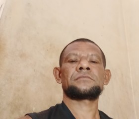 Mikeal Marianus, 41, Makassar