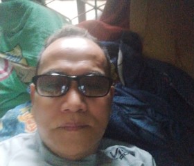 Junaidi, 50, Jambi City