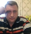 николай